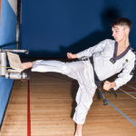 Jake breaking one board with side kick at Evesham Taekwondo school