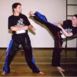 Michelle side kick to Tim at Evesham Taekwondo School