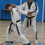 GM Dave Oliver with a defensive strike to the neck of 1st Dan Oliver Lea during a lesson at Evesham